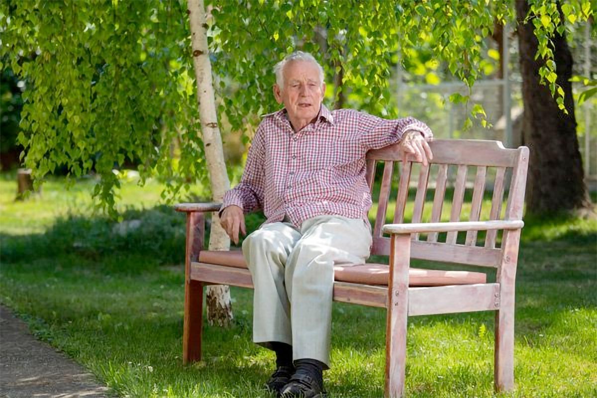 Older man sitting on bench